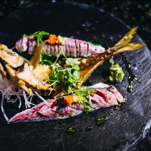 Whole aji (Japanese horse mackerel) sashimi